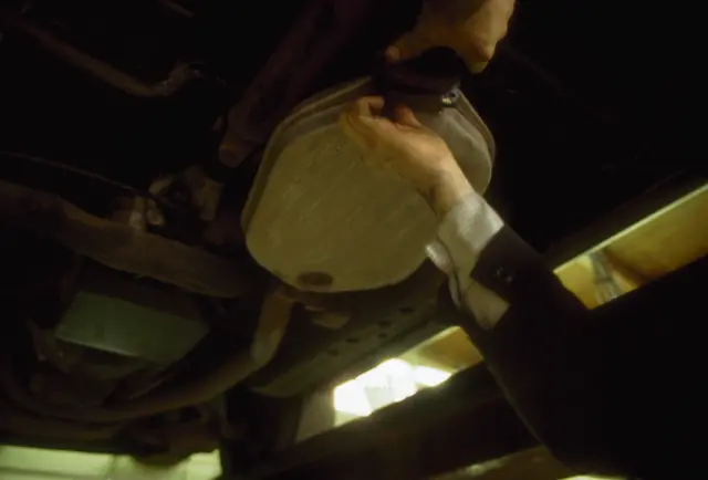 Catalytic converter beneath a car