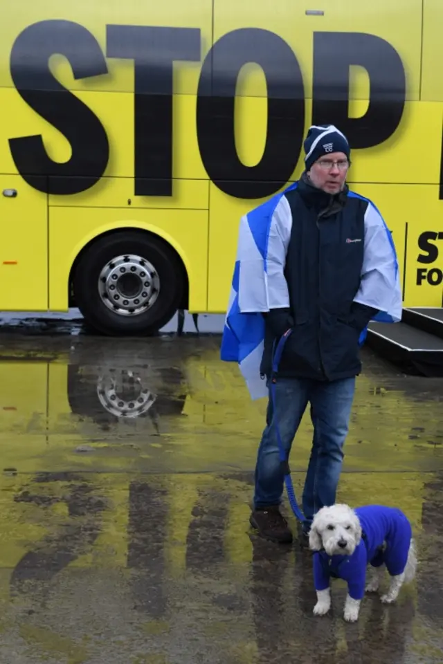 A supporter in front of the Scottish National Party's campaign bus as leader Nicola Sturgeon campaigns in Edinburgh