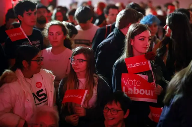 Supporters await Labour leader Jeremy Corbyn at an event in Birmingham