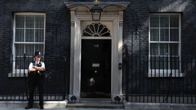 A policeman standing outside Downing Street