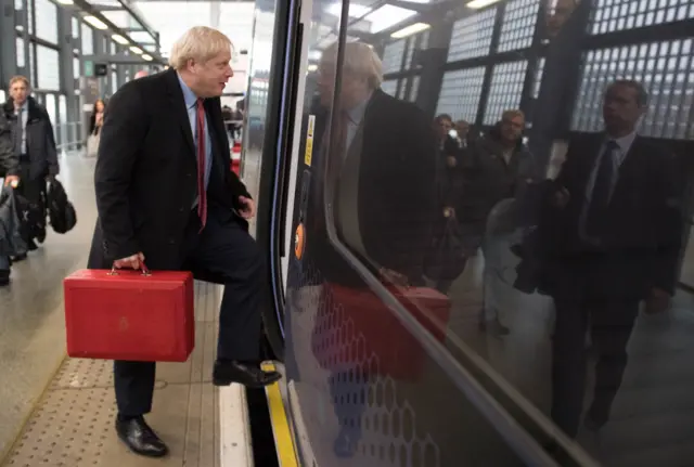 Boris Johnson boarding a train