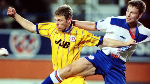 Wigan striker Graeme Jones and Luton defender Steve Davis