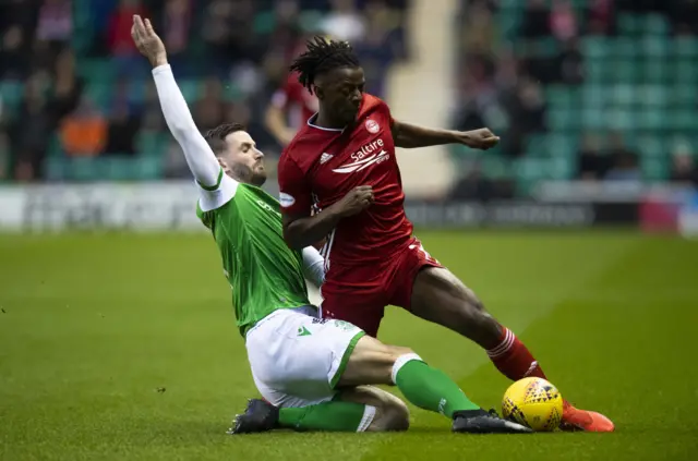 Hibernian's Jason Naismith is pictured in action with Aberdeen's Greg Leigh