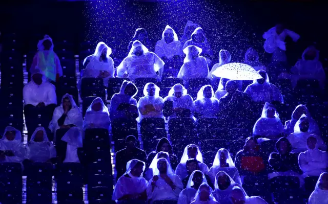 Fans in ponchos