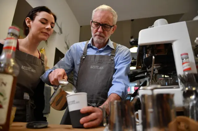 Jeremy Corbyn makes cup of coffee as he campaigns in Barry, south Wales on December 7, 2019