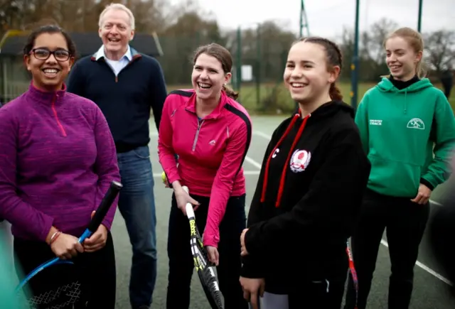 Jo Swinson with a group of young women at a tennis club