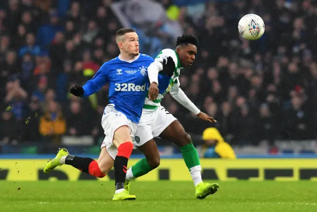 Ryan Kent and Jeremie Frimpong battle for possession at Hampden