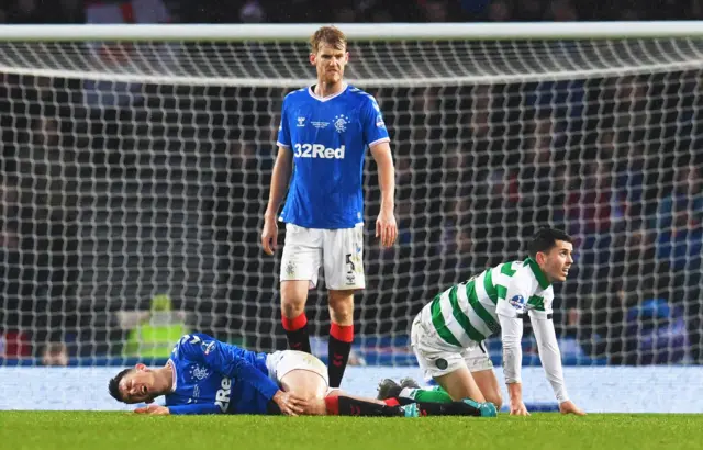 Ryan Jack (left) was injured challenging Celtic's Lewis Morgan