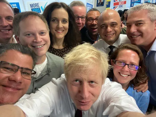 Boris Johnson surrounded by his cabinet