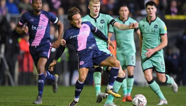 Jarrad Branthwaite tackling Dulwich Hamlet striker