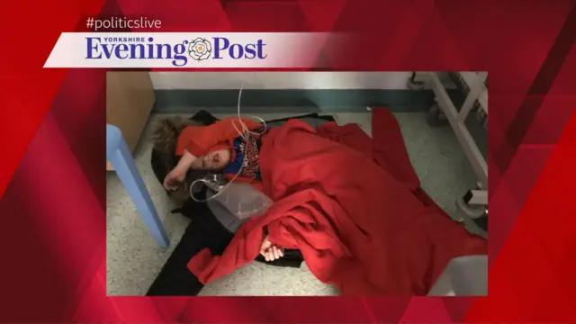 Photo in Yorkshire Post of boy sleeping on hospital floor