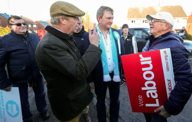 Nigel Farage talks with a Labour party supporter in Barnsley