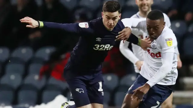 Tom Lawrence of Derby County and Darnell Fisher of Preston North End