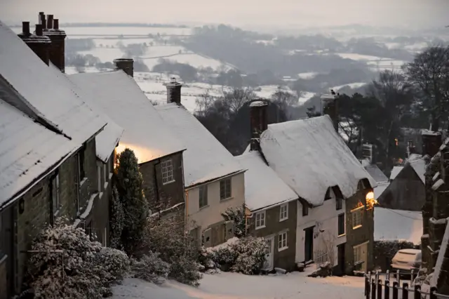 Snow covers houses in Gold Hill, in Shaftesbury, Dorse