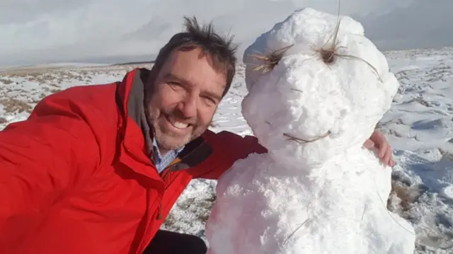 Man with snowman on Dartmoor