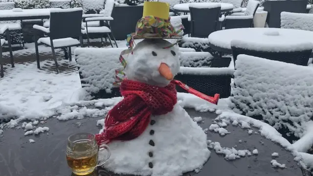 Mini snowman on an outside table