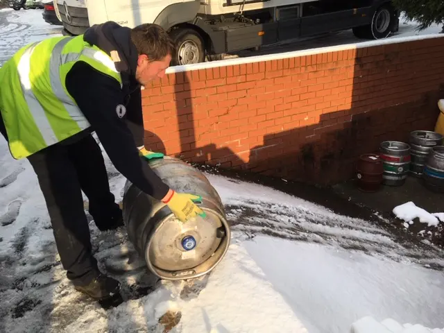 A courier with a beer cask