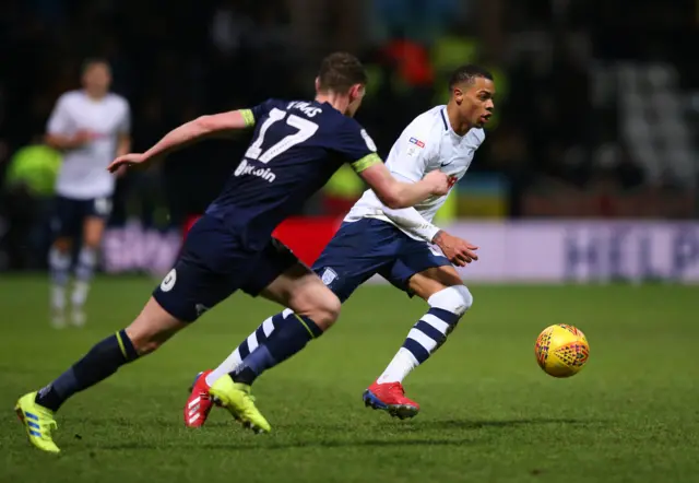 ukas Nmecha of Preston North End takes on George Evans of Derby County