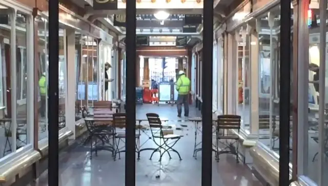 Corridor shopping centre with fallen debris