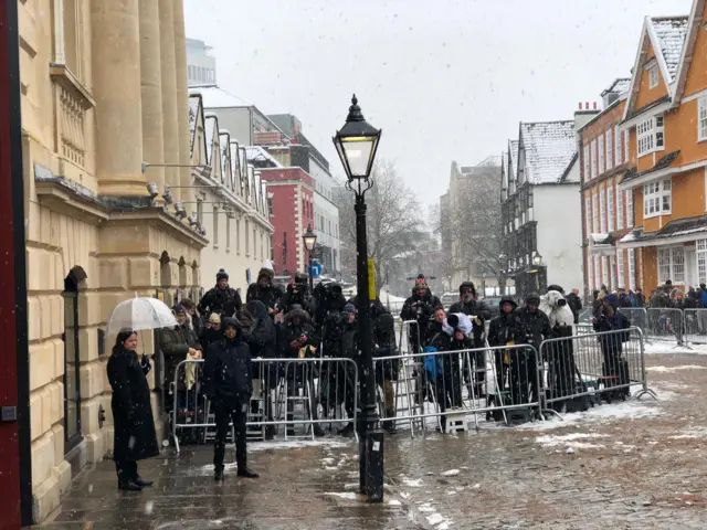 Image of press teams waiting for Harry and Meghan