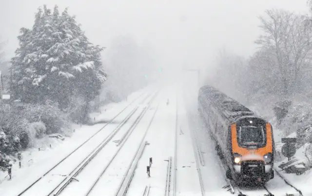 A passenger train in snow near Basingstoke