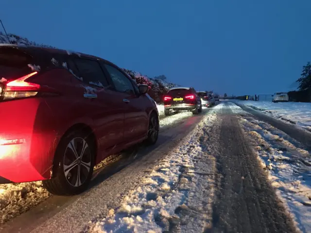 Traffic in snow on the A339