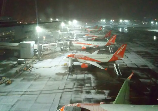 Handout photo taken with permission from the Twitter feed of @am_bennetts of snow at Gatwick Airport after snowfalls yesterday and overnight were expected to bring widespread disruption