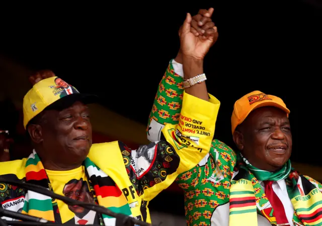 President Emmerson Mnangagwa and his deputy Constantino Chiwenga greet supporters of his ZANU PF party at a rally in Murombedzi, Zimbabwe November 24, 2018.