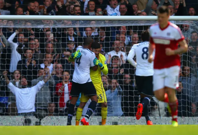 Hugo Lloris celebrates after saving a Steve Sidwell penalty in April 2014