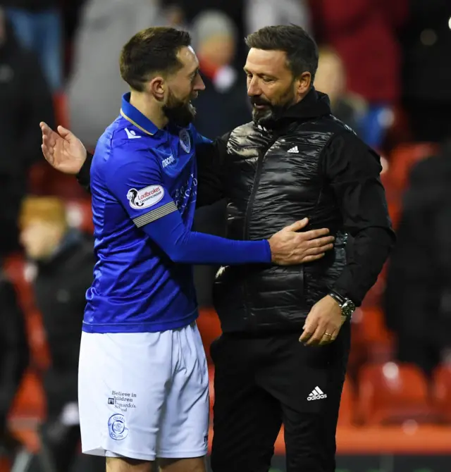 Queen of the South's Stephen Dobbie and Aberdeen's Derek McInnes