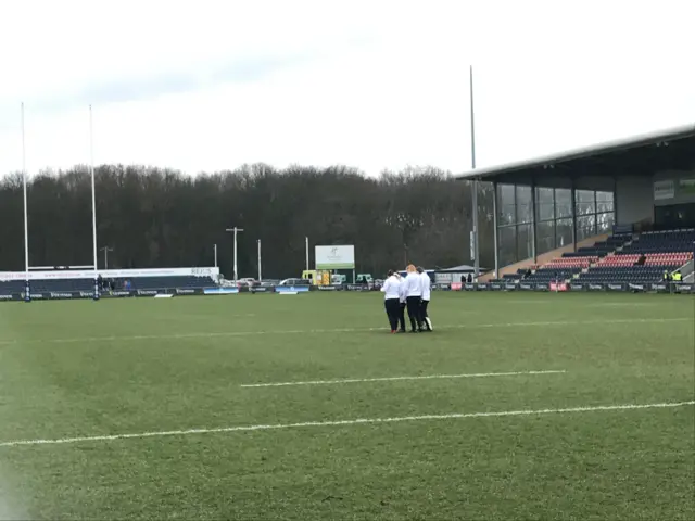 England players on the pitch for warm-up