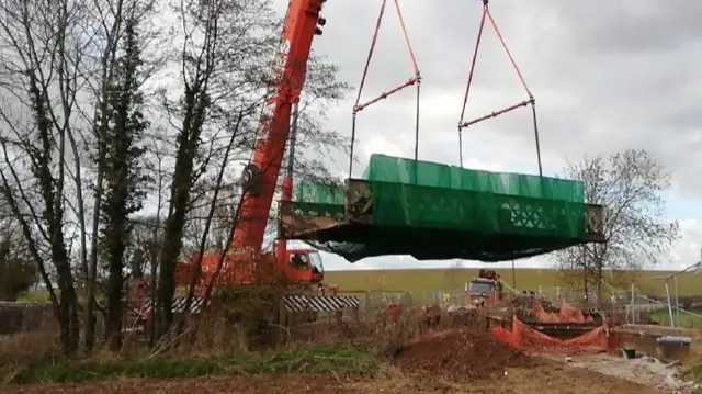 Bridge being lifted out