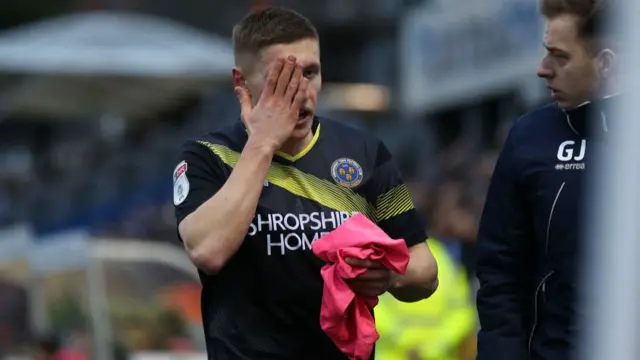 Greg Docherty of Shrewsbury Town leaves the match with an eye injury during the Sky Bet League One match