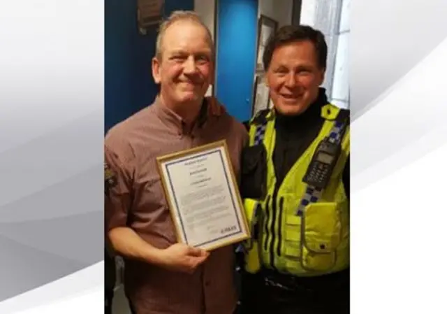 JOHN GOODALL AND POLICE OFFICER