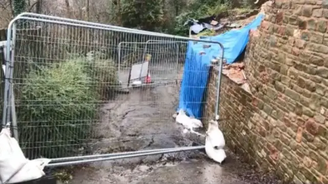 Barrier around collapsed wall