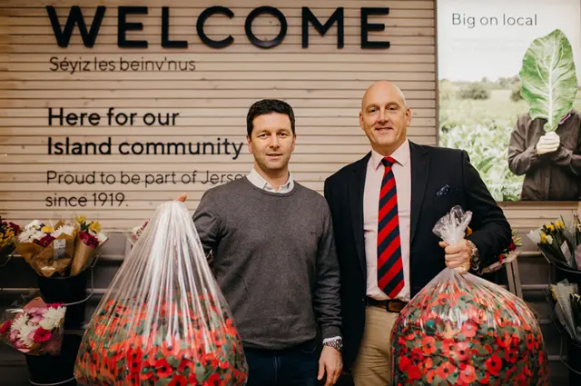 Carl Winn and Al Brown with bags of poppies