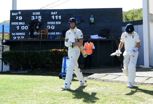 Joe Root and Ben Stokes walk to the middle