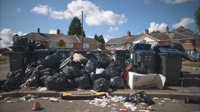 Piled up binbags of rubbish