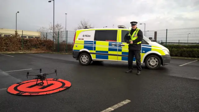 A police officer with a drone