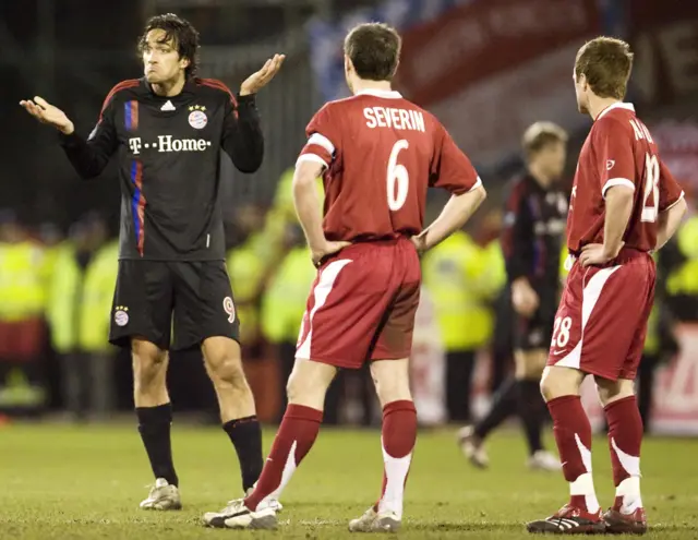 Bayern Munich's Luca Toni (left) is watched by Aberdeen's Scott Severin and Alan Maybury back in 2008