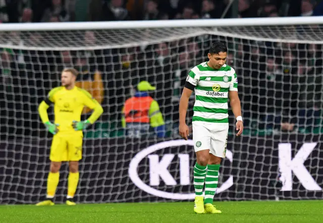 Celtic's Emilio Izaguirre (R) looks dejected after Celtic concede their second goal