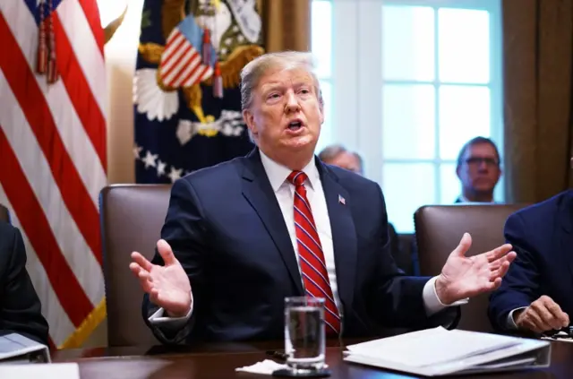 Trump speaking in the Cabinet room in the White House on 12 Feb