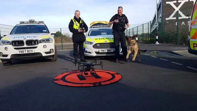 Drone and police officers