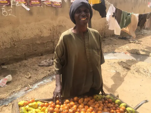 Fruit seller smiling