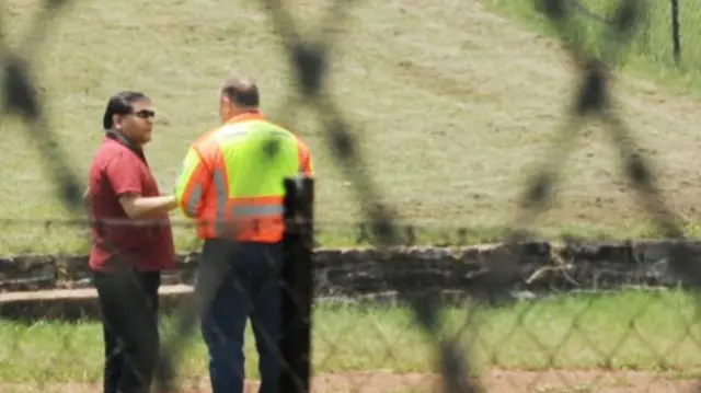 Ajay Gupta (in the red shirt and sunglasses)