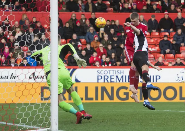 Lewis Ferguson rises to nod in the equaliser for Aberdeen