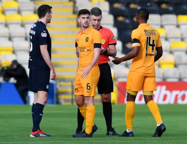 Shaun Byrne receives a red card from referee Greg Aitken