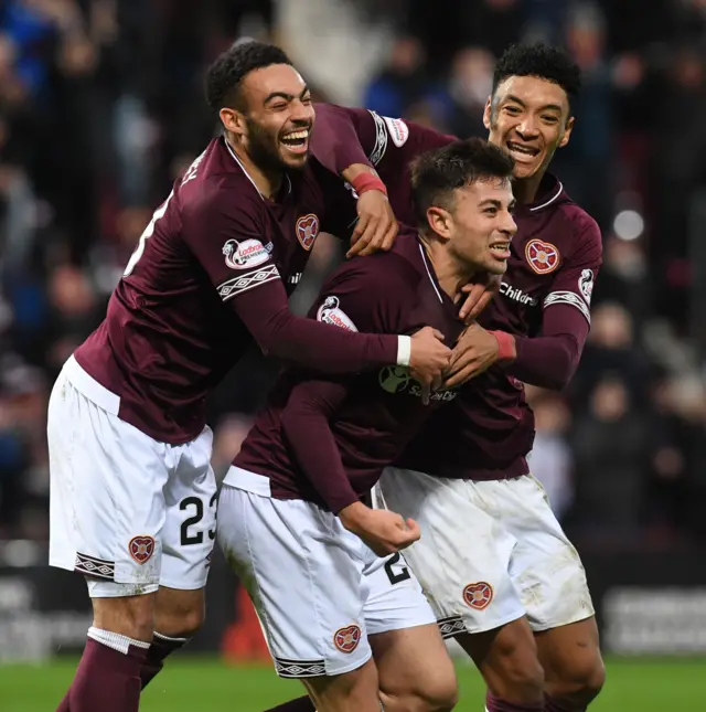 Marcus Godinho (centre) starts for Hearts