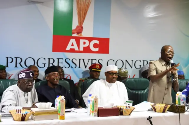 Candidate of the All Progressives Congress (APC), President Mohammadu Buhari (C) sit next to party national leader Bola Tinubu (L) and Vice President Yemi Osinbajo (2ndL) as party chairman Adams Oshiomhole (R) speakduring the party caucus emergency meeting on the postponed general elections in Abuja, on February 18, 2019