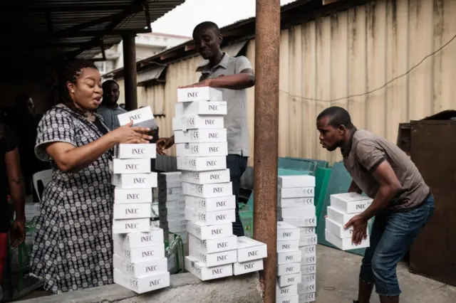 Staff of the Independent National Electoral Commission (INEC) start confirming over again 7,000 portable permanent voter card (PVC) readers ahead of the postponed predidential and general election at the River State INEC office in Port Harcourt, southern Nigeria, on February 18, 2019